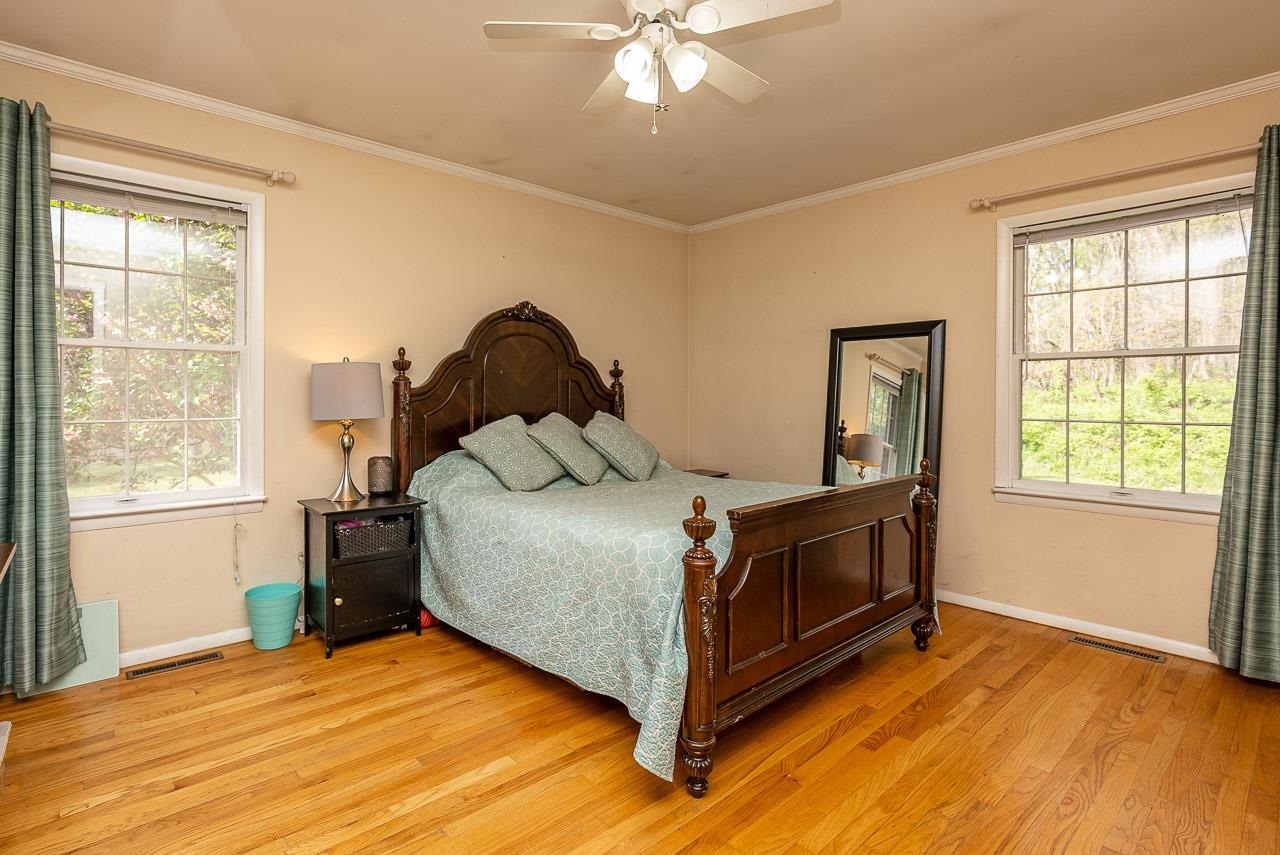 2833 Shutterlee Mill Road Staunton, VA 24401 - Photo 27 of 70 a bed sitting in a bedroom next to a window
