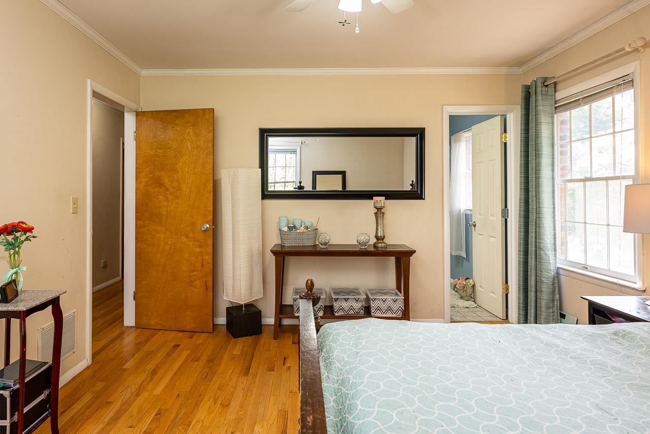 2833 Shutterlee Mill Road Staunton, VA 24401 - Photo 28 of 70 a bedroom with a bed and a table with potted plant