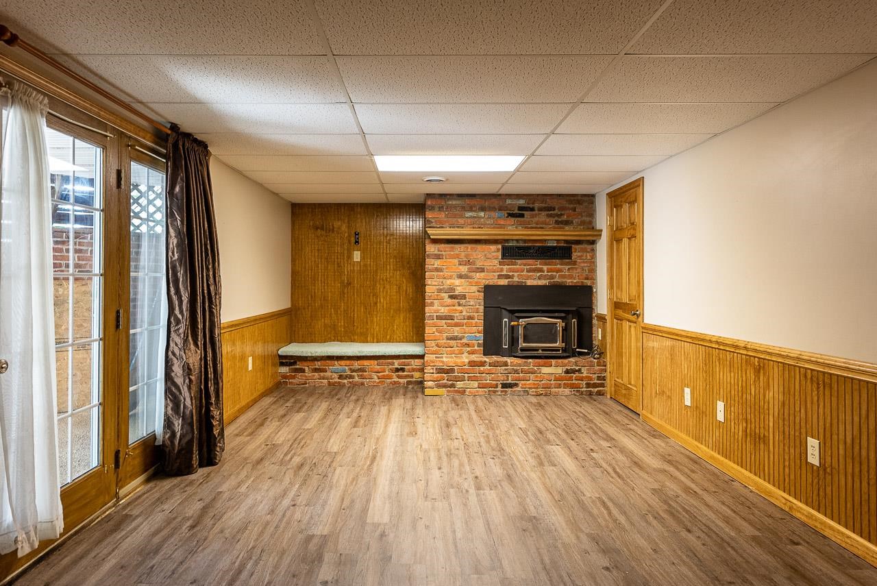 2833 Shutterlee Mill Road Staunton, VA 24401 - Photo 36 of 70 a view of an empty room with a fireplace and a window