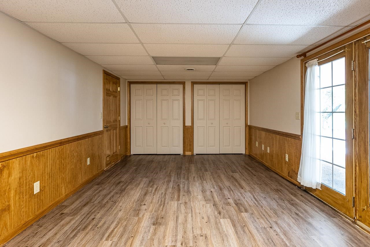 2833 Shutterlee Mill Road Staunton, VA 24401 - Photo 37 of 70 a view of an empty room with wooden floor and a window