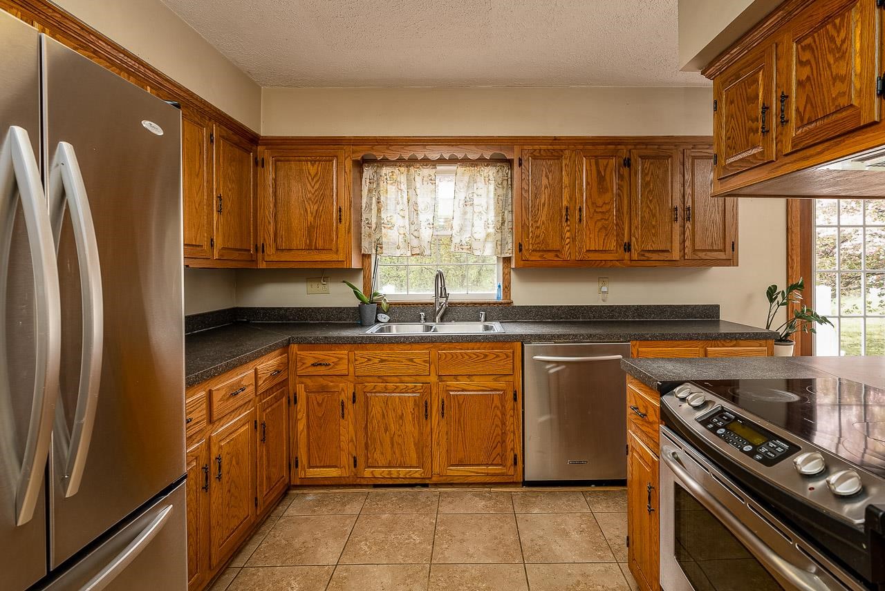 2833 Shutterlee Mill Road Staunton, VA 24401 - Photo 6 of 70 a kitchen with stainless steel appliances granite countertop a refrigerator and a sink
