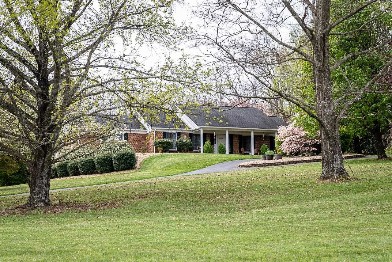2833 Shutterlee Mill Road Staunton, VA 24401 - Photo 7 of 70 a view of a house with a big yard and large trees