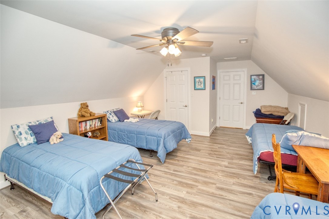 7075 Menzels Road Toano, VA 23168 - Photo 43 of 50 Room with sloped ceilings, wood-finish flooring, a