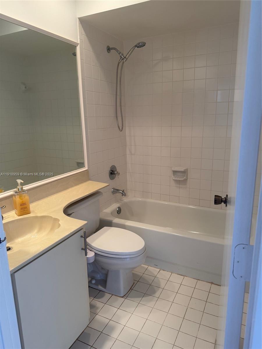 13773 Southwest 147th Cir Lane, Unit 121 Miami, FL 33186 - Photo 12 of 16 a bathroom with a sink toilet and shower