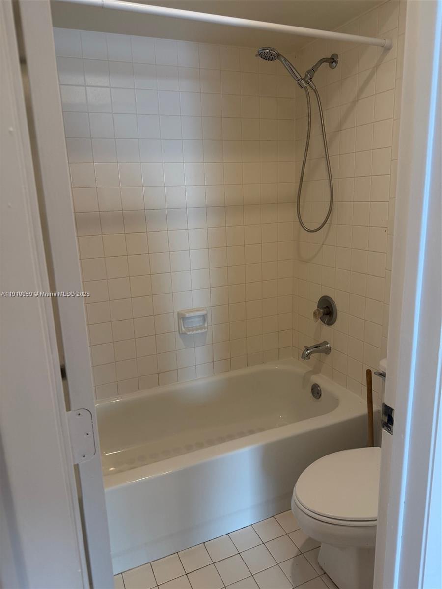 13773 Southwest 147th Cir Lane, Unit 121 Miami, FL 33186 - Photo 14 of 16 a bathroom with a shower and a toilet