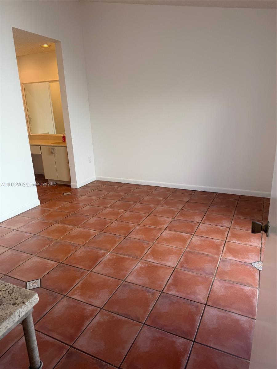 13773 Southwest 147th Cir Lane, Unit 121 Miami, FL 33186 - Photo 16 of 16 a view of a livingroom with wooden floor and a window
