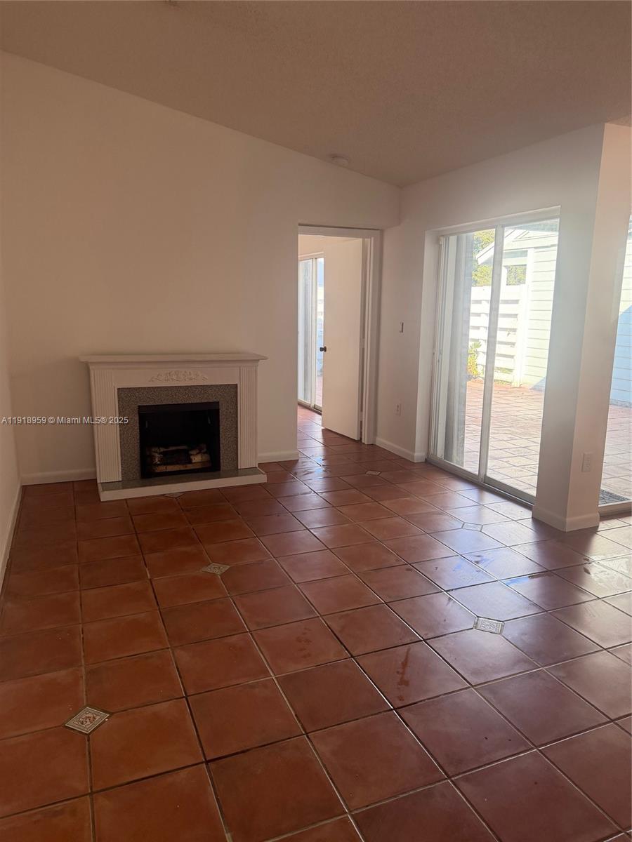 13773 Southwest 147th Cir Lane, Unit 121 Miami, FL 33186 - Photo 9 of 16 a view of an empty room with glass door and glass door