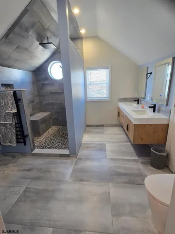 a bathroom with a sink and mirror