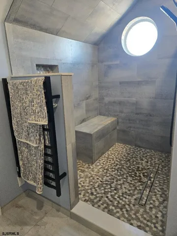 a bathroom with a sink and a shower