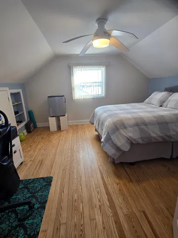 a bedroom with a bed and lamps