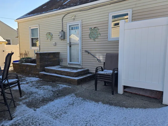 a view of backyard with outdoor seating
