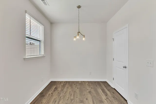 a bathroom with a sink a mirror and a window