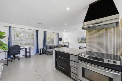 a kitchen with a stove and a refrigerator