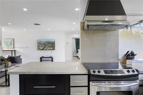 a kitchen with a stove and a refrigerator