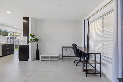 a view of a workspace with furniture