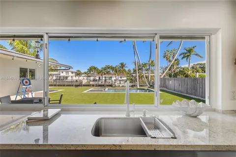 a view of swimming pool with outdoor seating