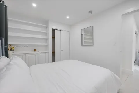 a view of a bedroom with closet and bed