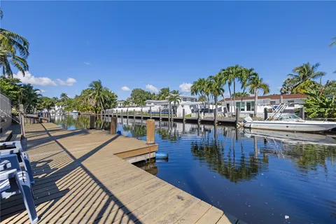 a view of a swimming pool with seating area