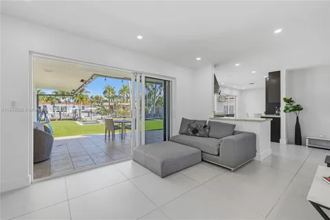 a living room with furniture and a swimming pool