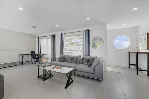 a living room with furniture and a window