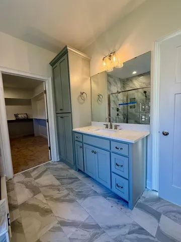 a bathroom with a sink double vanity and a mirror