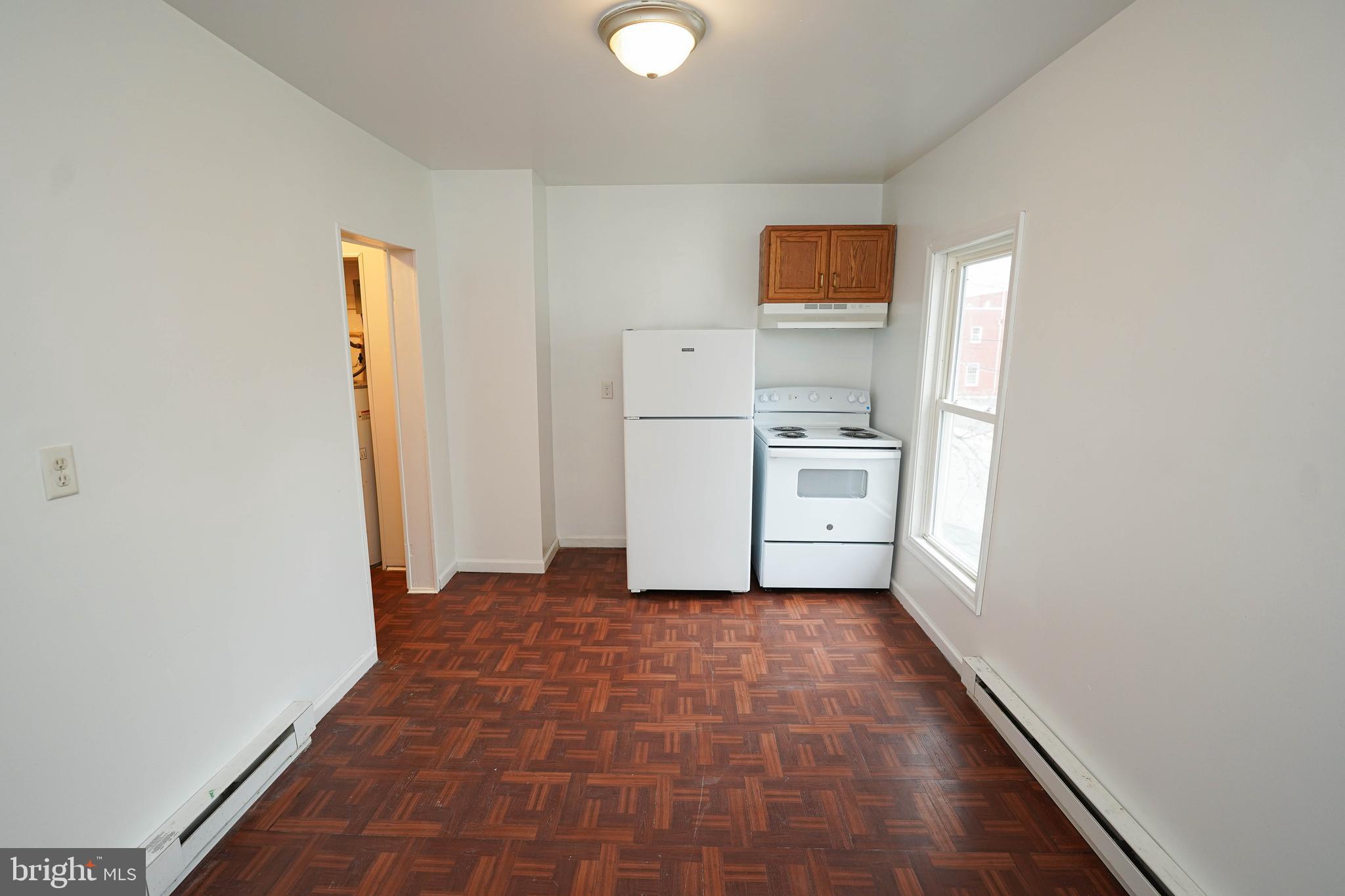417 Walnut Street, Unit 2 Pocomoke City, MD 21851 - Photo 18 of 33 a view of a kitchen with a sink and a refrigerator