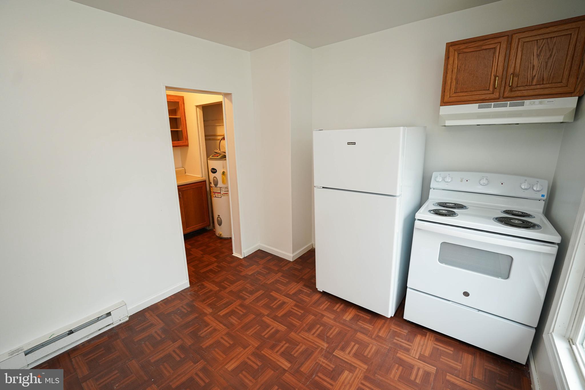 417 Walnut Street, Unit 2 Pocomoke City, MD 21851 - Photo 20 of 33 a view of a storage and utility room with a refrigerator