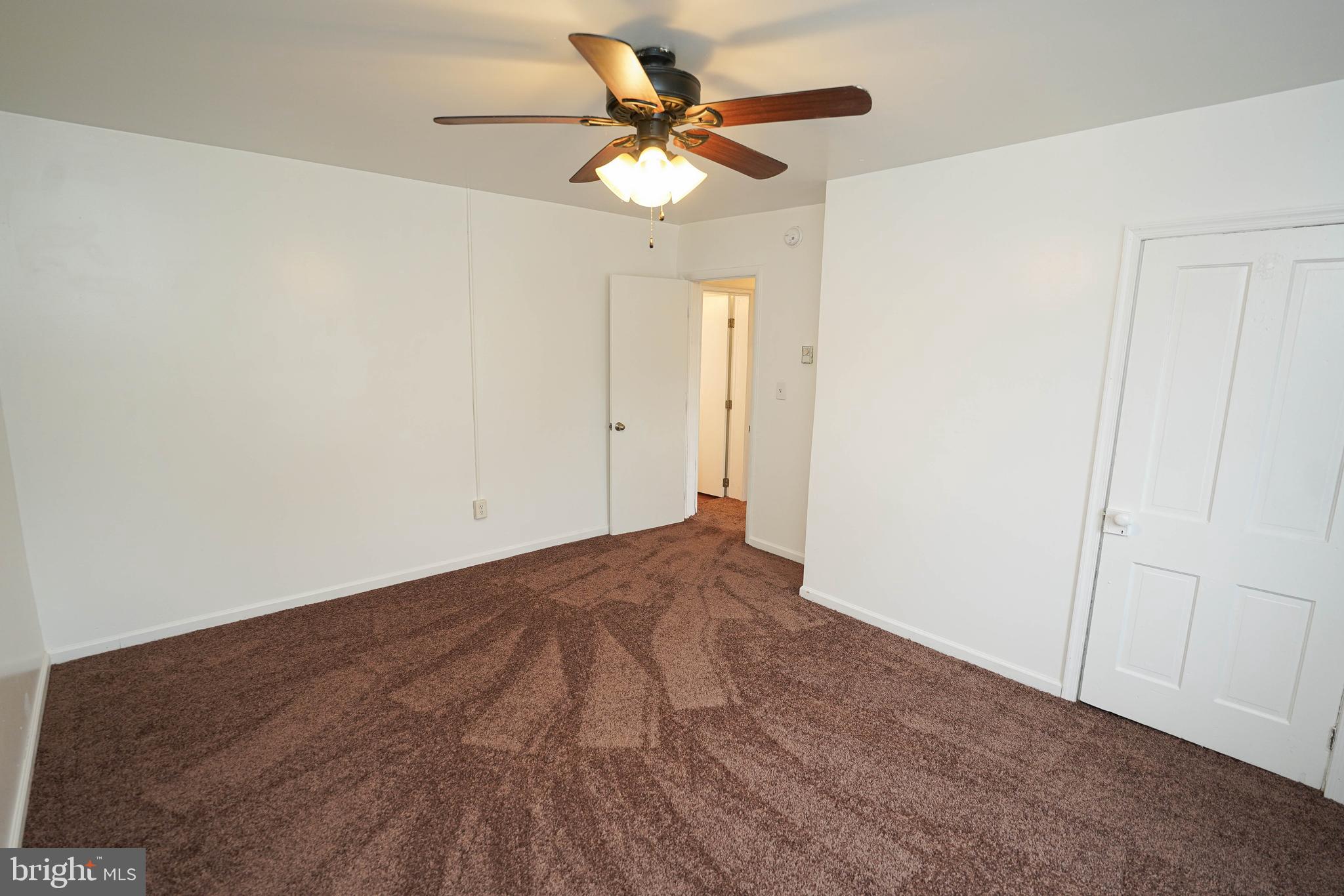 417 Walnut Street, Unit 2 Pocomoke City, MD 21851 - Photo 25 of 33 a view of empty room with a ceiling fan