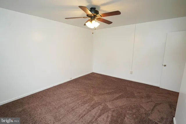 a view of a big room with carpet