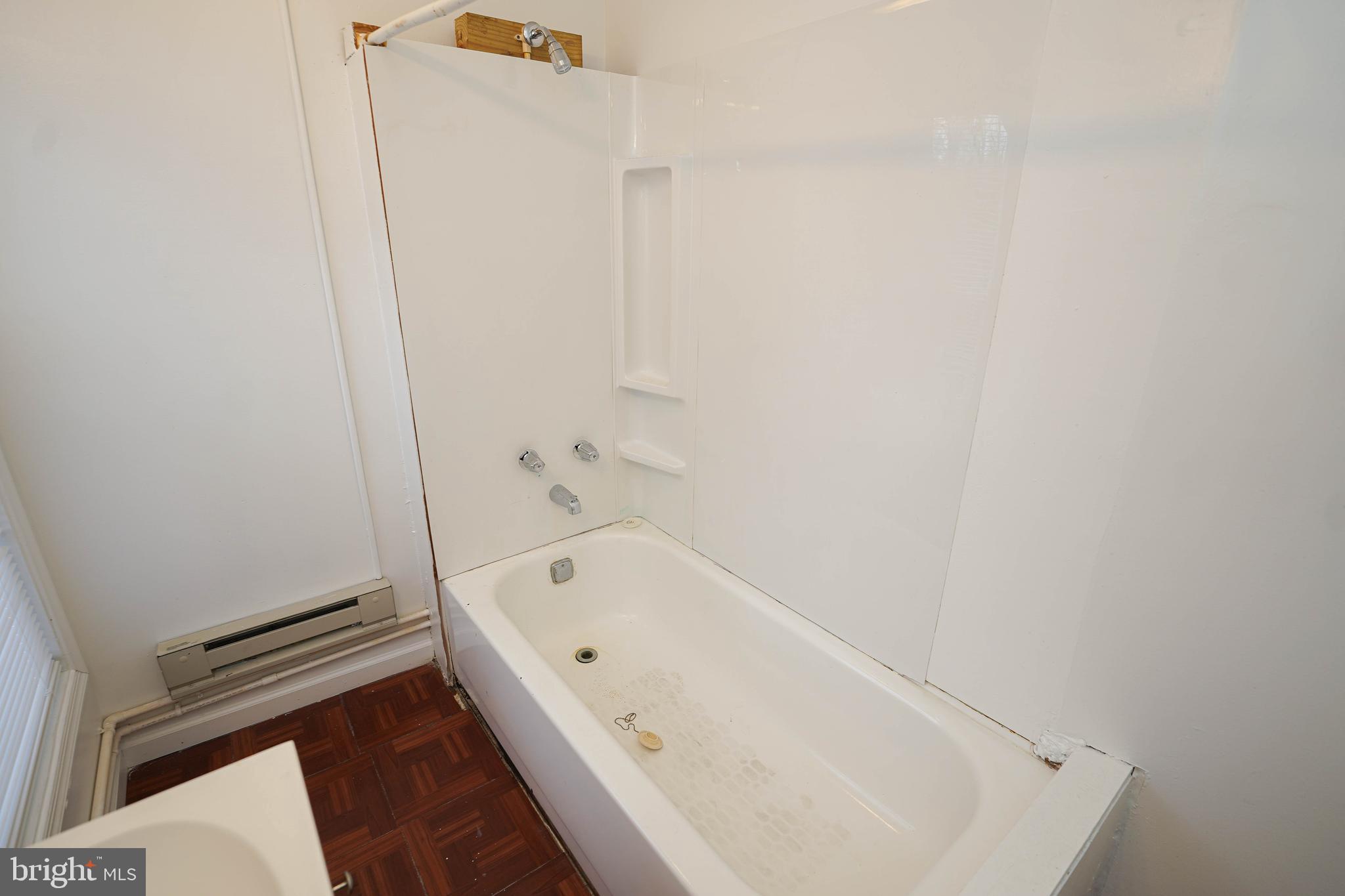 417 Walnut Street, Unit 2 Pocomoke City, MD 21851 - Photo 30 of 33 a bathroom with a bathtub