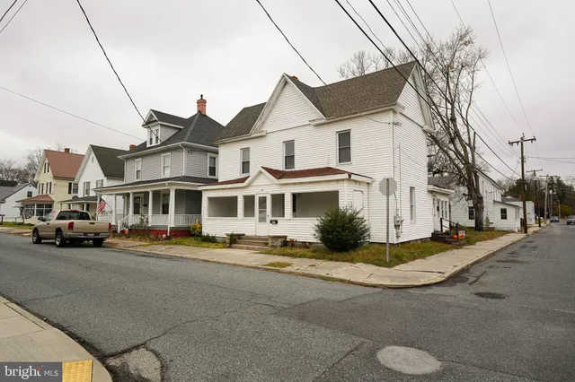 a view of multiple houses with a street