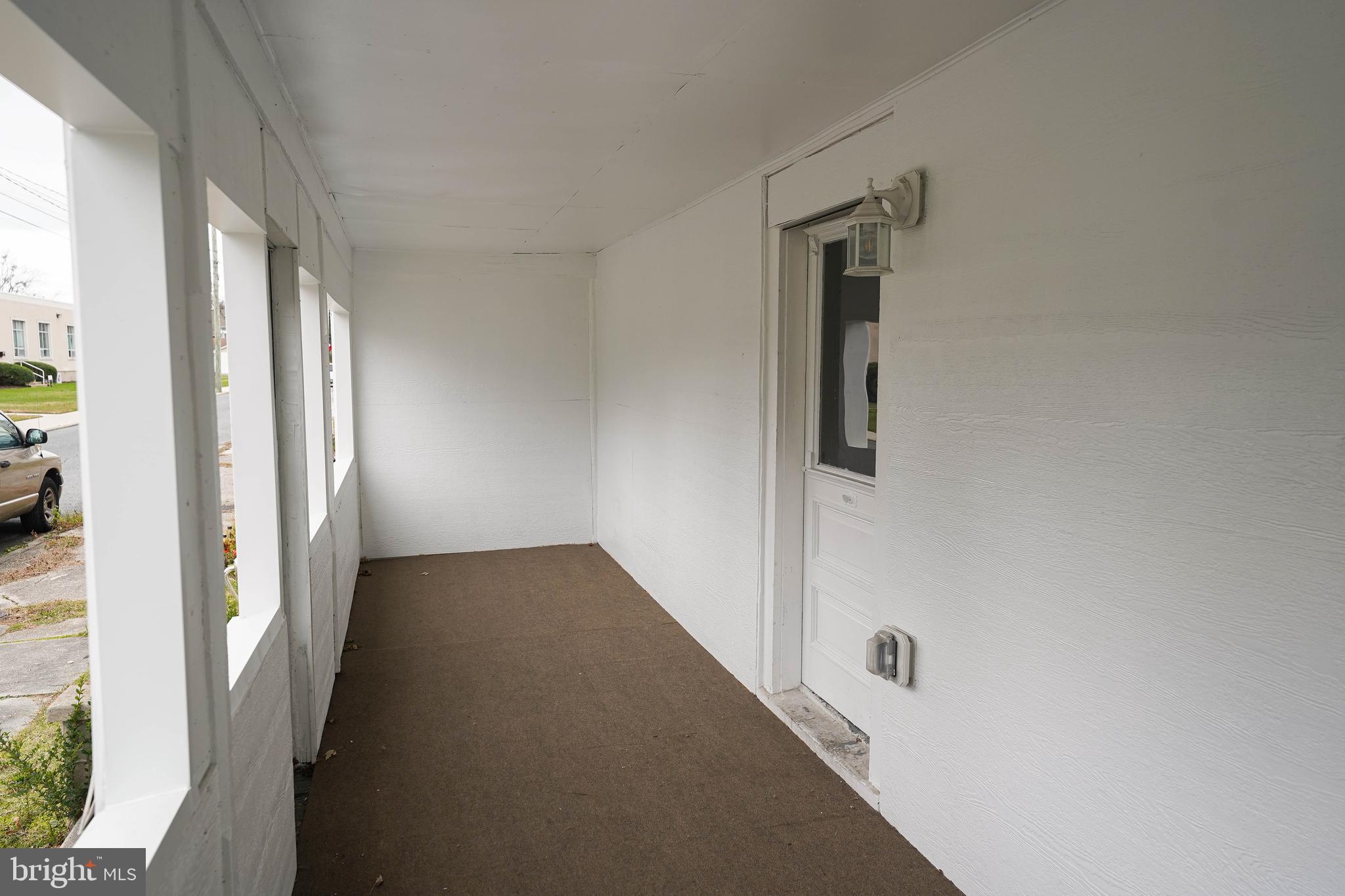 417 Walnut Street, Unit 2 Pocomoke City, MD 21851 - Photo 5 of 33 a view of a hallway with windows and entryway