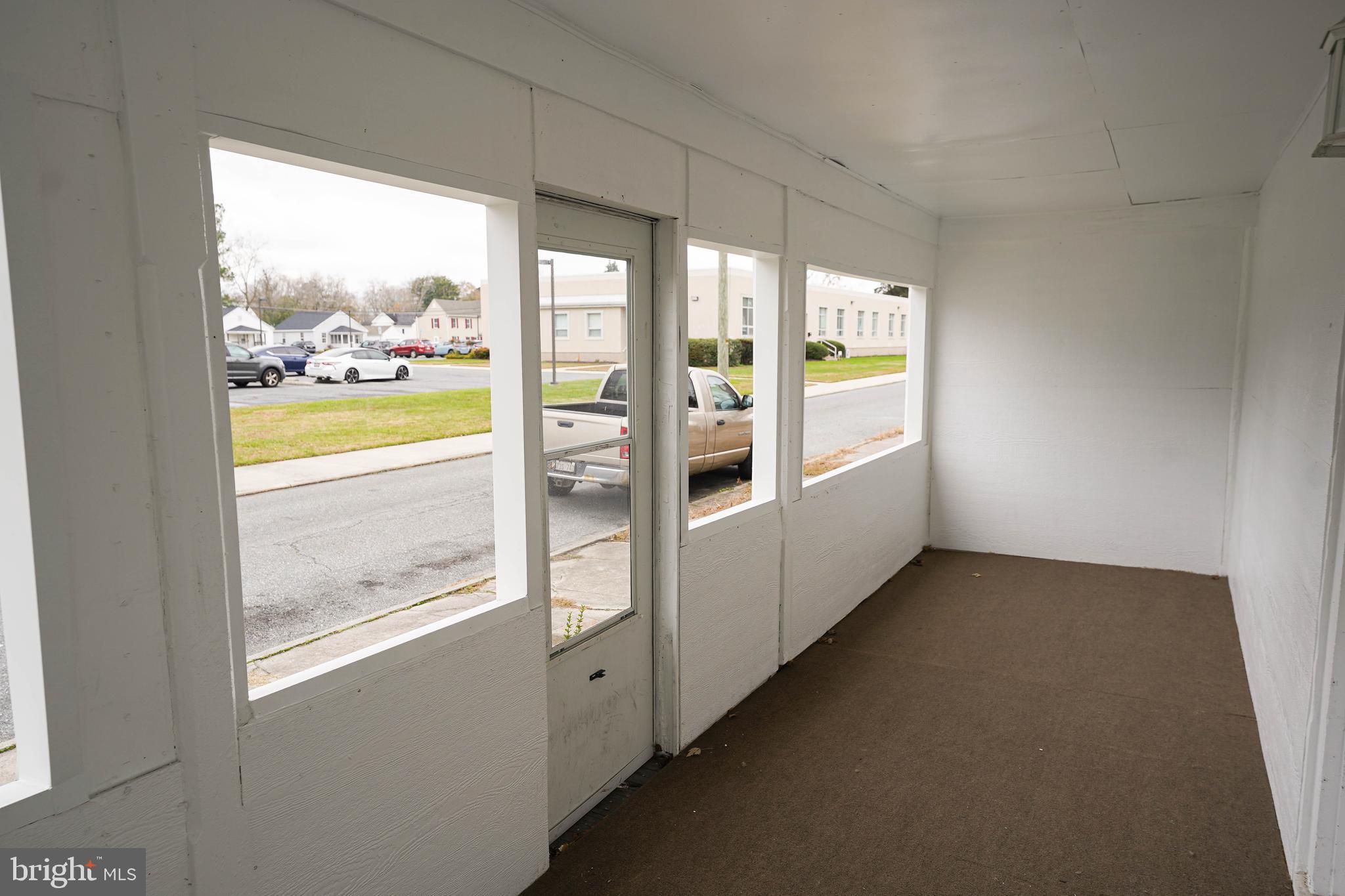 417 Walnut Street, Unit 2 Pocomoke City, MD 21851 - Photo 6 of 33 a view of an empty room and window
