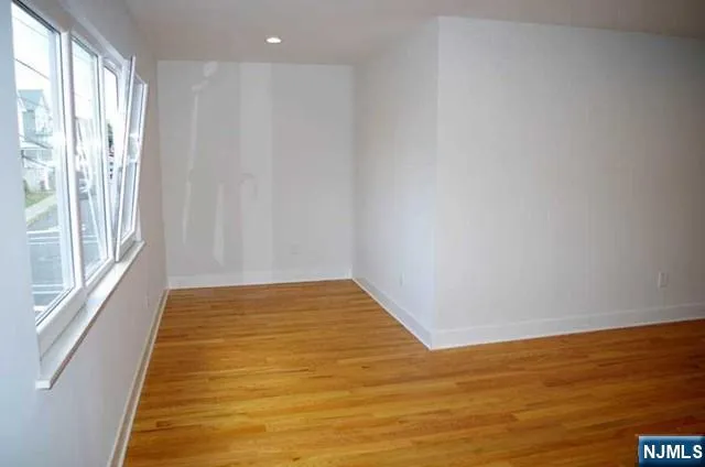 a bathroom with a granite countertop toilet and a sink