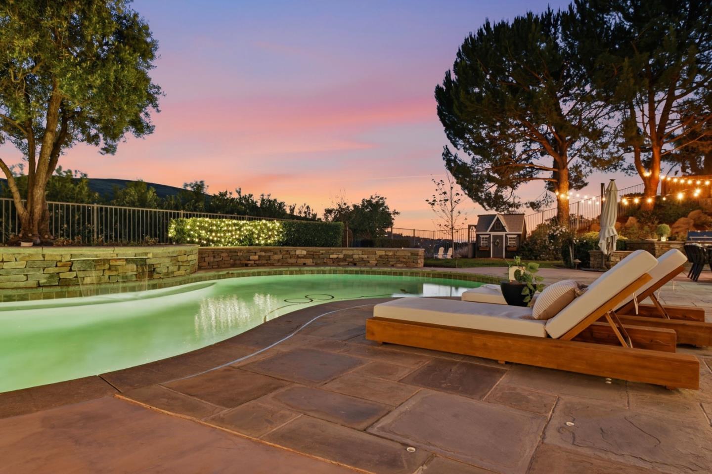 2566 Bentley Ridge Drive San Jose, CA 95138 - Photo 11 of 101 a view of swimming pool with seating space and trees in the background