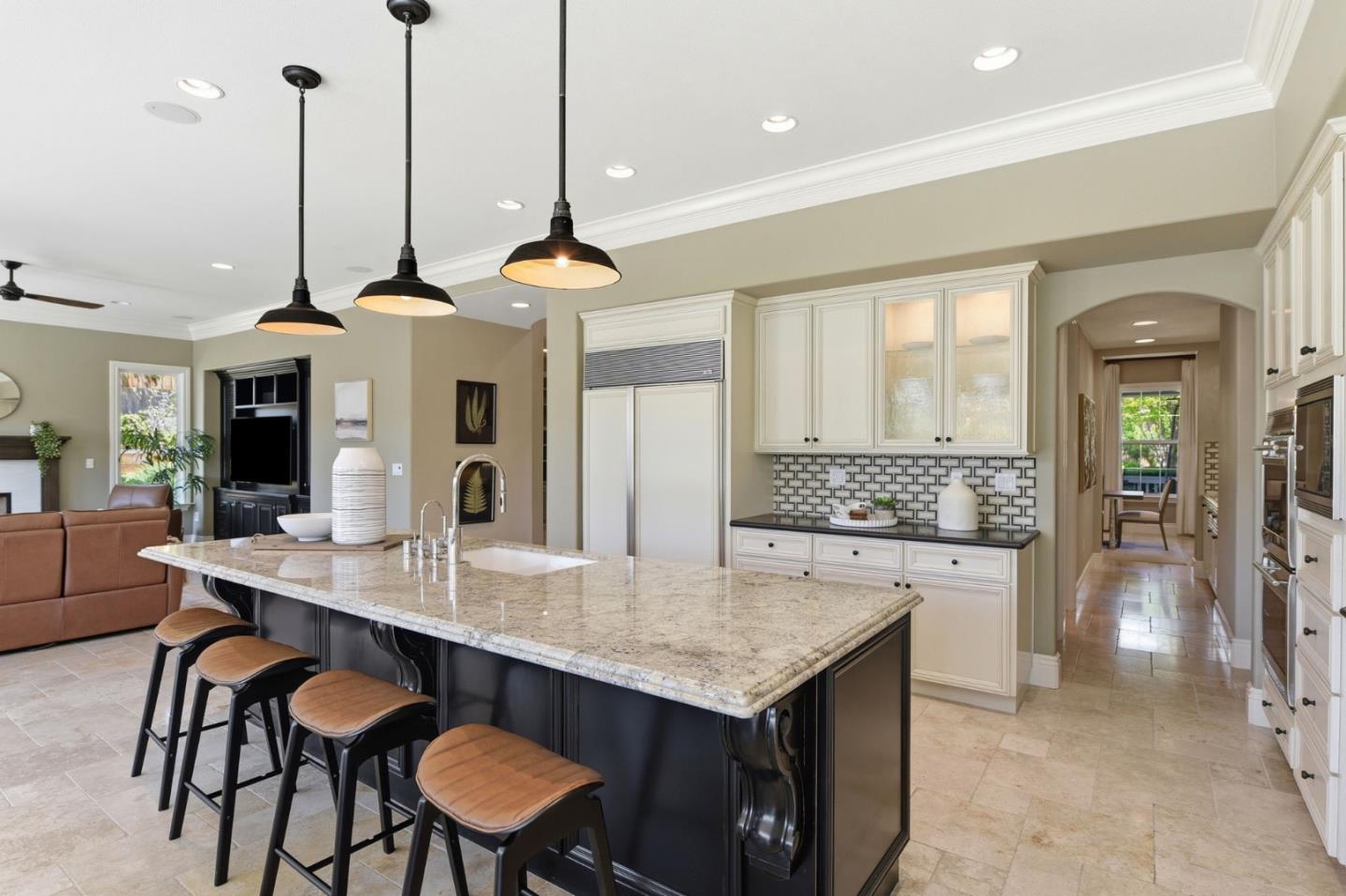 2566 Bentley Ridge Drive San Jose, CA 95138 - Photo 37 of 101 a kitchen with a table and chairs in it