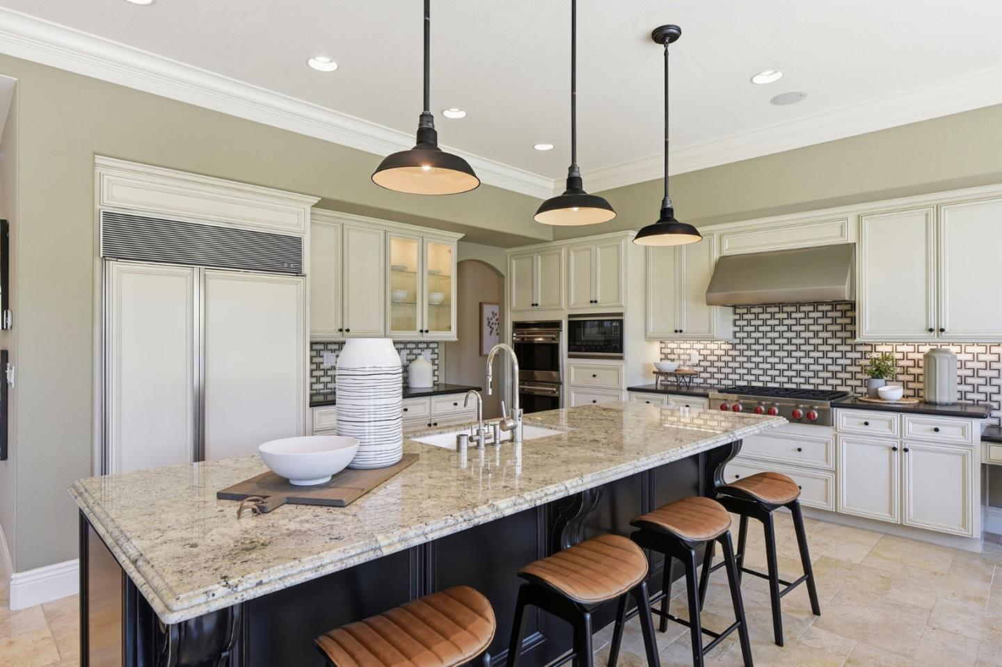 2566 Bentley Ridge Drive San Jose, CA 95138 - Photo 40 of 101 a kitchen with granite countertop white cabinets and chairs