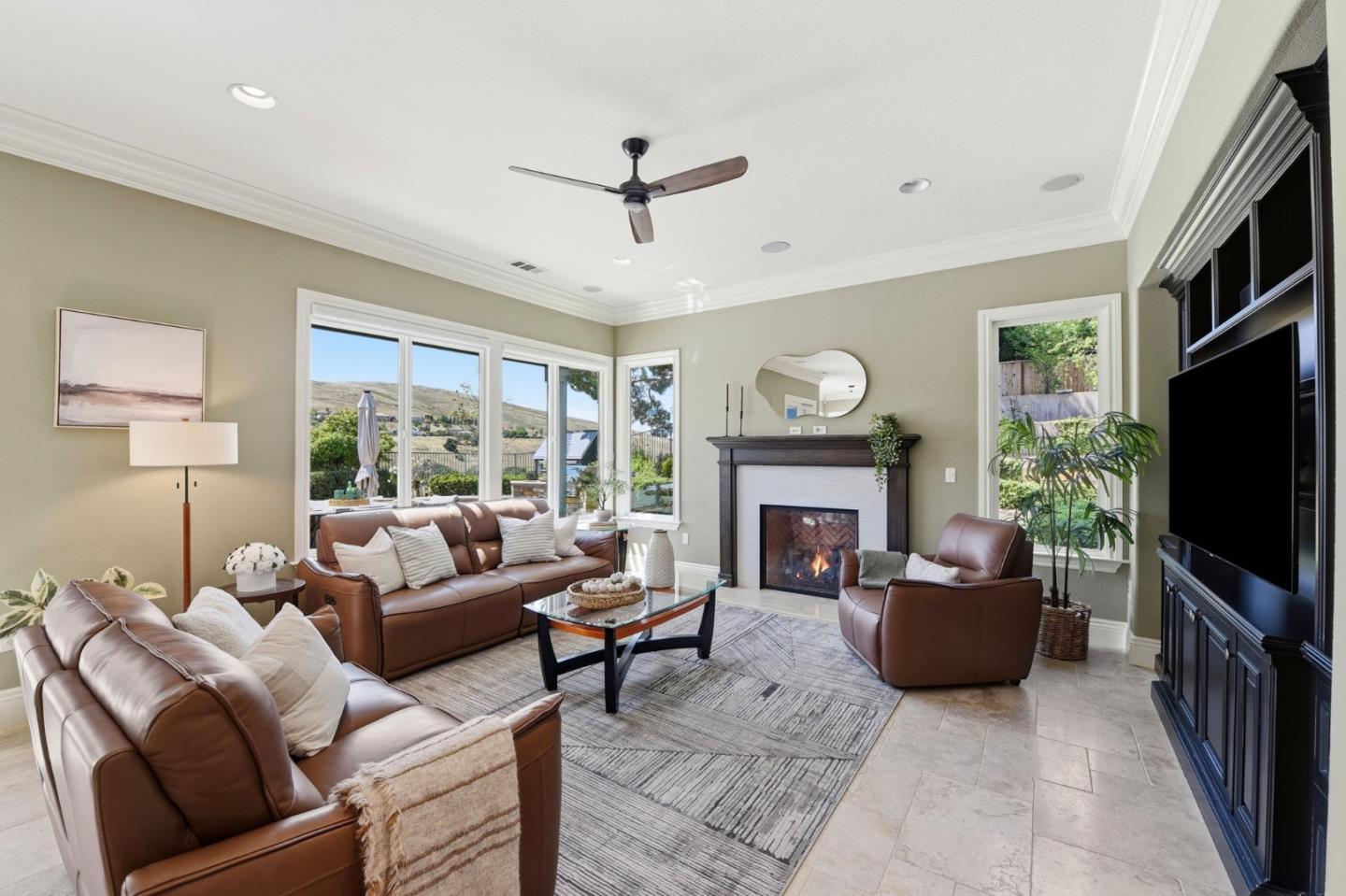2566 Bentley Ridge Drive San Jose, CA 95138 - Photo 42 of 101 a living room with furniture a fireplace and a flat screen tv