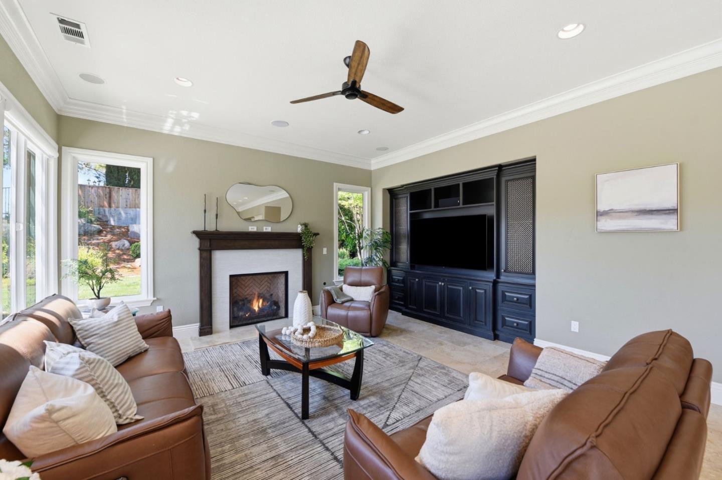 2566 Bentley Ridge Drive San Jose, CA 95138 - Photo 44 of 101 a living room with furniture a flat screen tv and a fireplace