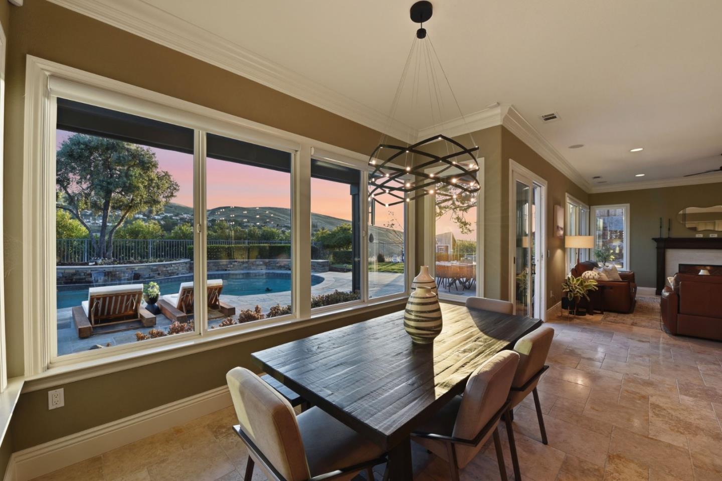 2566 Bentley Ridge Drive San Jose, CA 95138 - Photo 46 of 101 a dining room with furniture a chandelier and a large window