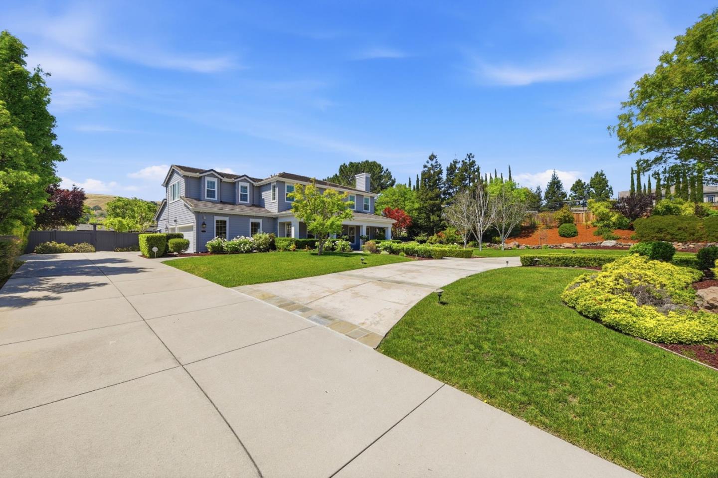 2566 Bentley Ridge Drive San Jose, CA 95138 - Photo 5 of 101 a front view of a house with a yard and trees