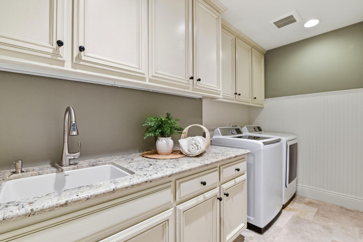 2566 Bentley Ridge Drive San Jose, CA 95138 - Photo 51 of 101 a kitchen with granite countertop white cabinets and a sink