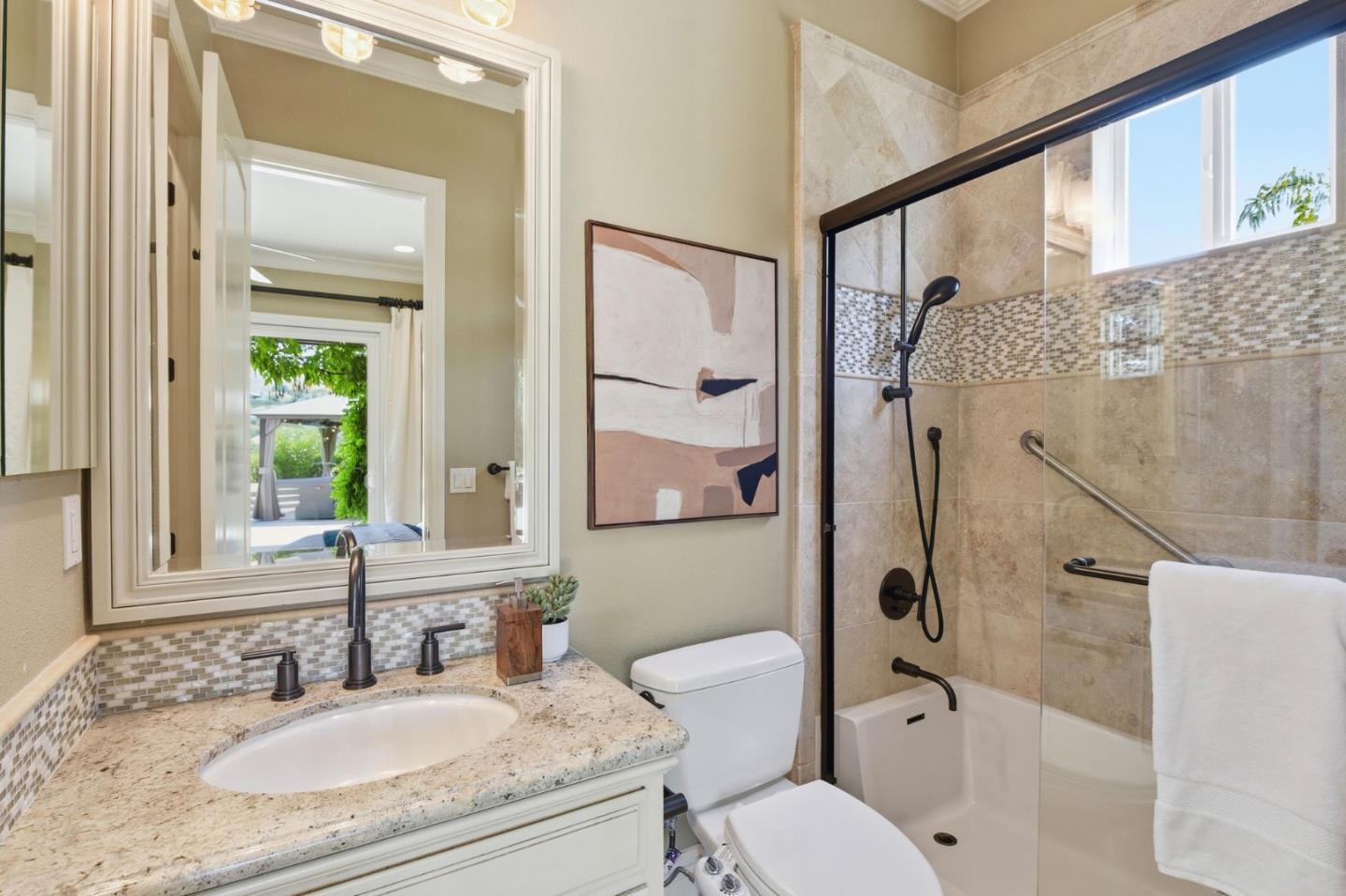 2566 Bentley Ridge Drive San Jose, CA 95138 - Photo 54 of 101 a bathroom with a granite countertop sink toilet and shower