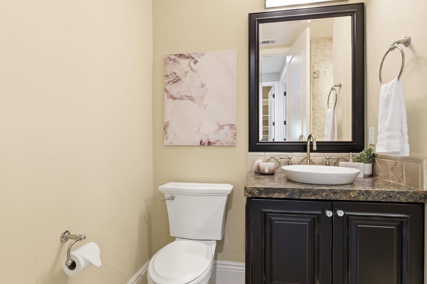 2566 Bentley Ridge Drive San Jose, CA 95138 - Photo 55 of 101 a bathroom with a granite countertop sink toilet and mirror