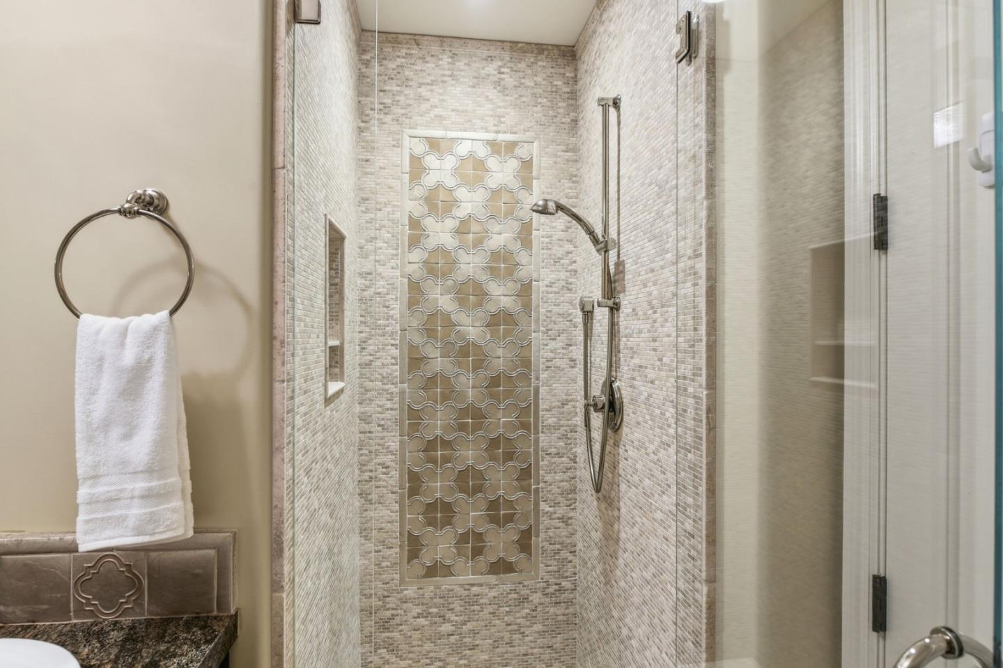 2566 Bentley Ridge Drive San Jose, CA 95138 - Photo 56 of 101 a bathroom with a shower a sink and a mirror