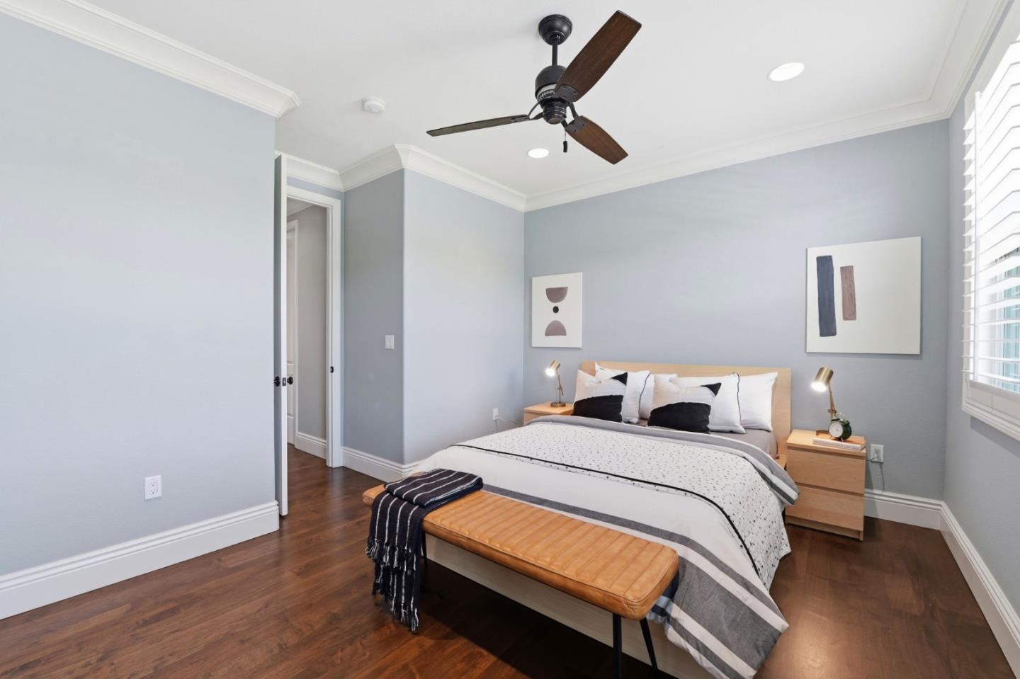 2566 Bentley Ridge Drive San Jose, CA 95138 - Photo 61 of 101 a bedroom with a bed and a ceiling fan