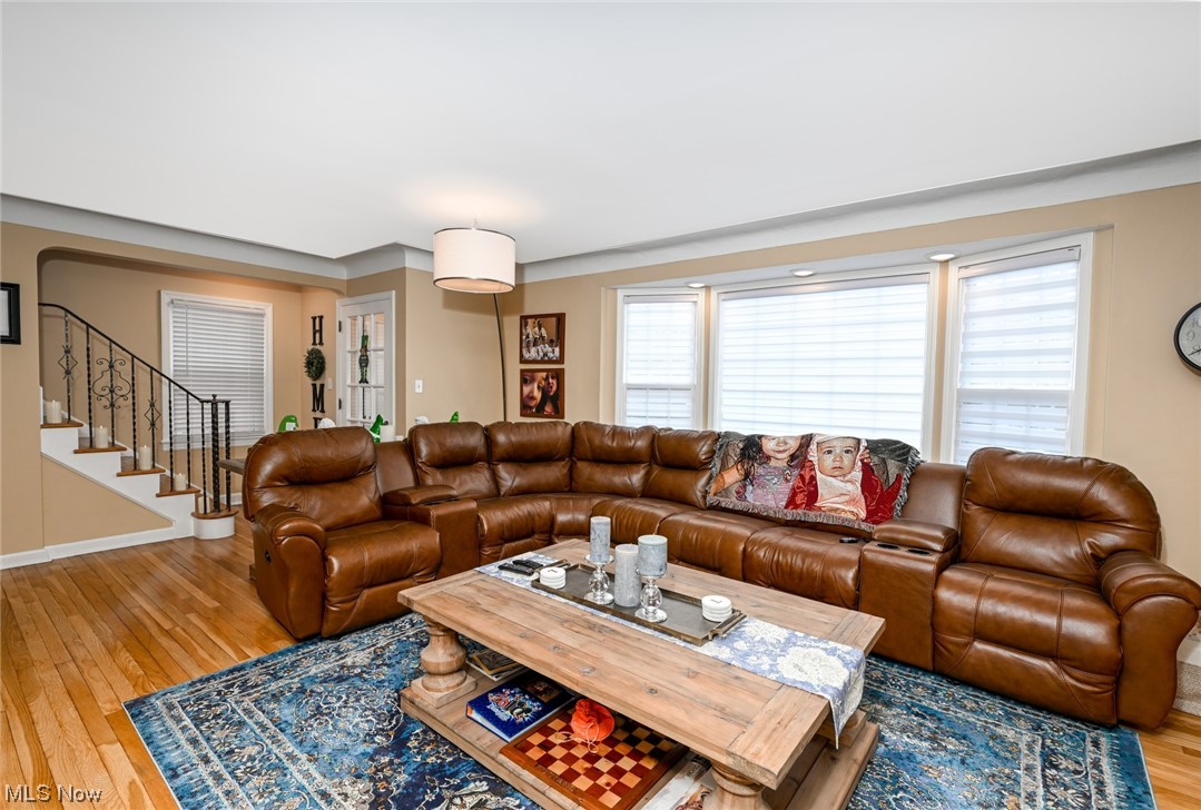 3913 Faversham Road Cleveland, OH 44118 - Photo 11 of 34 Living room with Gleaming solid Hrwd floors, crown molding wall of windows