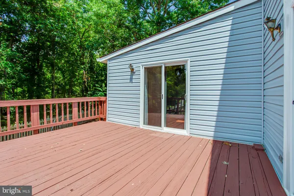 a view of a house with wooden deck