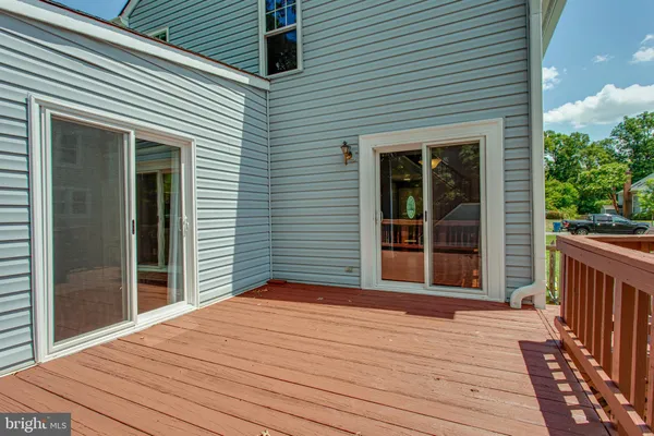 a view of a house with wooden deck