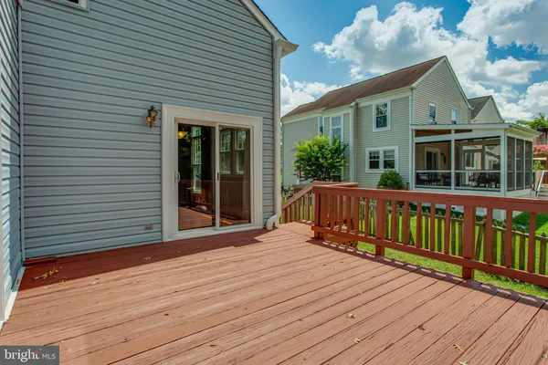 a view of a house with wooden deck
